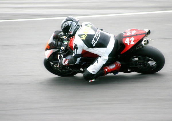 A cornering racing motorcycle