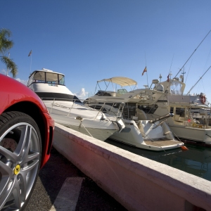 The marina at Puerto Banus in Southern Spain, with a red Ferrari in the foreground