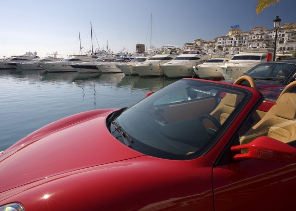 The marina at Puerto Banus in Southern Spain, with a red Ferrari in the foreground