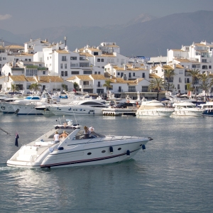 A luxury motor boat entering the harbour at Puerto Banus