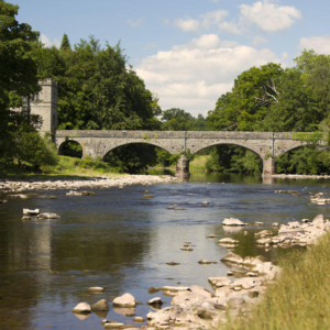 A traditional stone bridge over the River Usk in South Wales