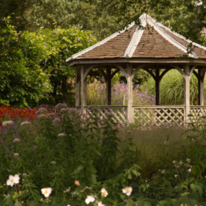 A pavilion in an English country garden in high summer