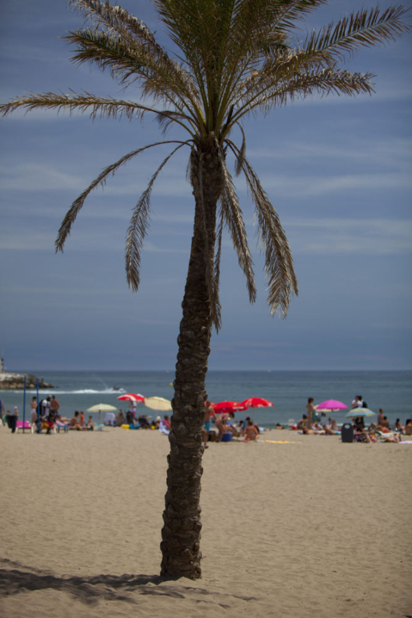 Summer holidays on the beach at Portofino near Marbella in Southern Spain on the Costa del Sol